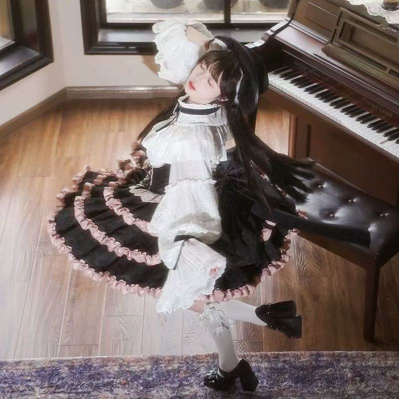 Design Concept:

This Sweet Lolita black and pink suspender cake skirt features a playful yet elegant design with a large bow and trailing detail, creating a charming and eye-catching look. Product Details: The product includes one suspender cake skirt only, offering a unique piece that pairs well with various tops for a cute and stylish Lolita outfit.