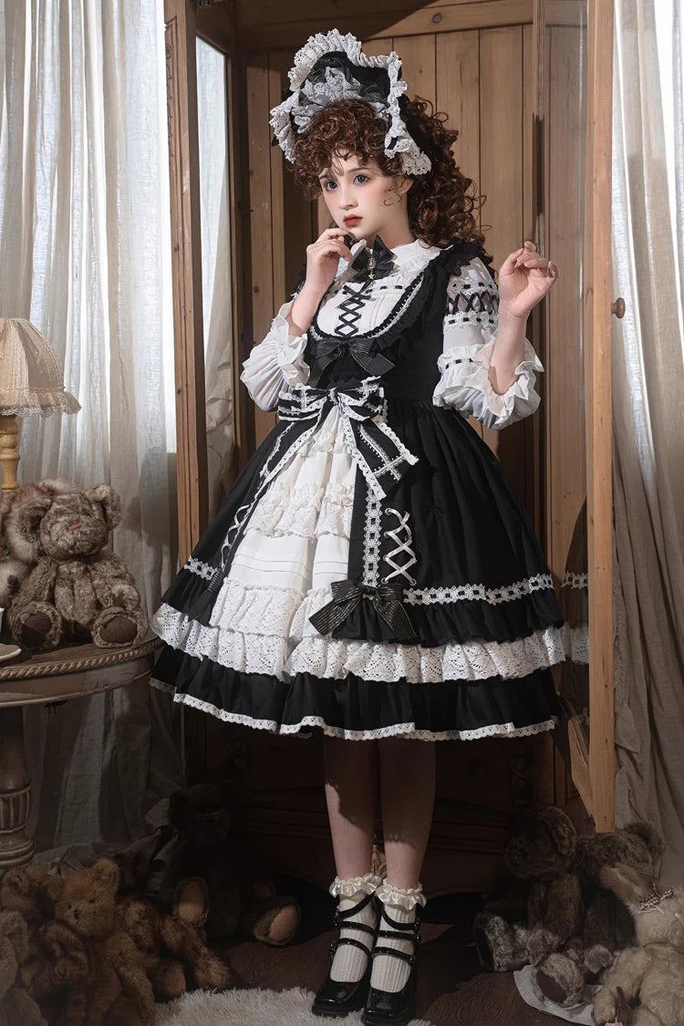 Design Concept:&nbsp;

This Sweet Lolita black and white sleeveless JSK dress features layered ruffles, delicate lace, and bow details, creating a soft and elegant Lolita style. The contrasting colors highlight its sweet yet refined design, making it a versatile choice for various occasions. The product includes one JSK dress.
