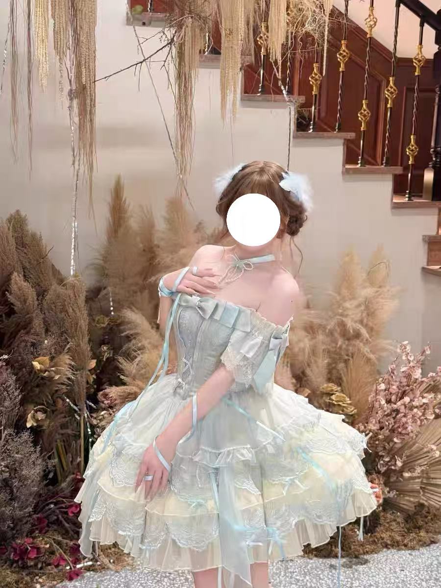 Design Concept:

This exquisite Sweet Lolita dress draws inspiration from classical ballet, featuring a delicate blue color scheme and intricate embroidery that creates an atmosphere of elegant sweetness. The dress comes with a beautifully crafted bow accent on the chest and includes a detachable train, adding a touch of princess-like grandeur to your ensemble. Made from high-quality tulle and cotton fabrics, the full skirt creates a lovely silhouette reminiscent of a ballerina's tutu, while the detailed em