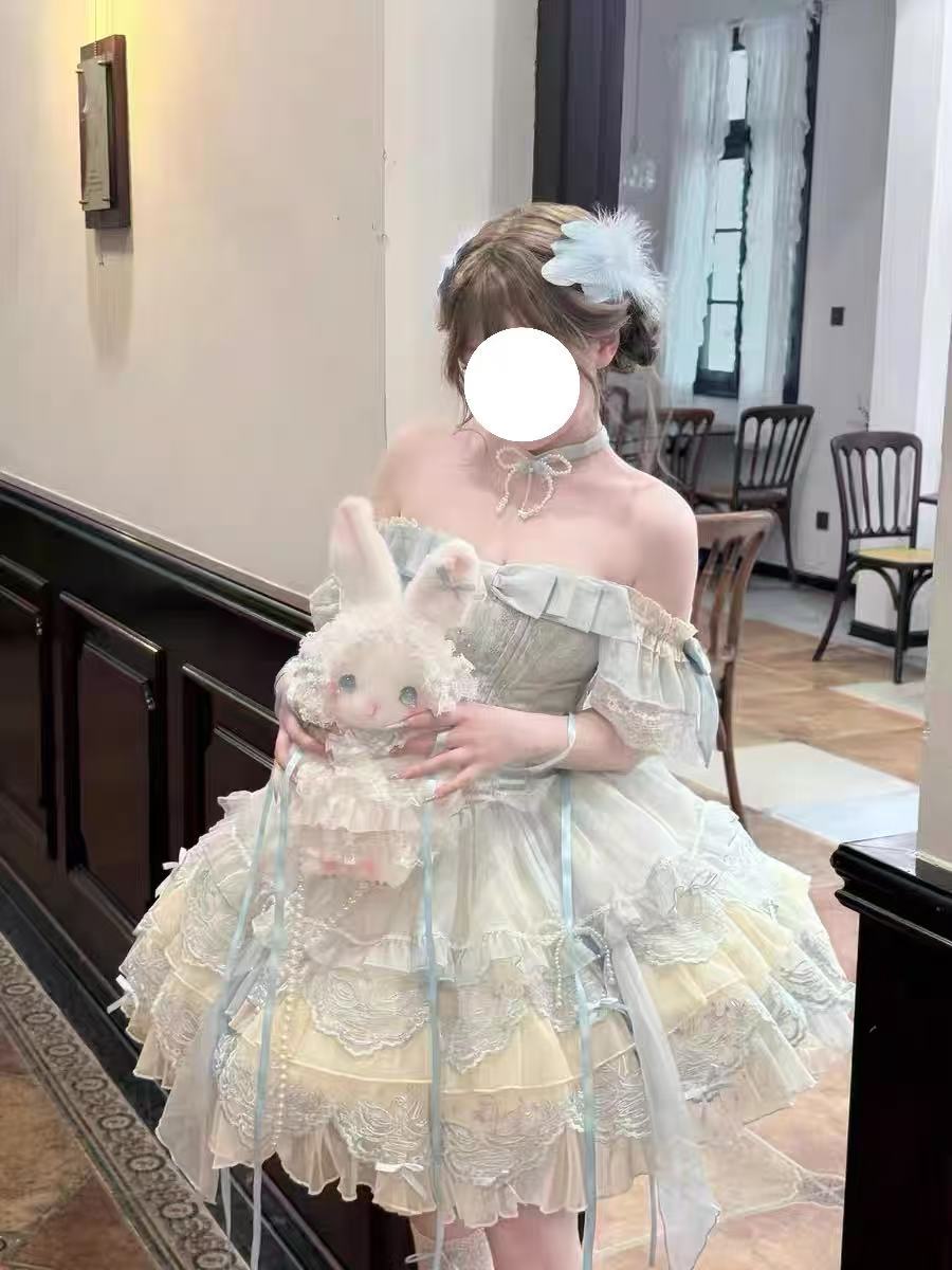 Design Concept:

This exquisite Sweet Lolita dress draws inspiration from classical ballet, featuring a delicate blue color scheme and intricate embroidery that creates an atmosphere of elegant sweetness. The dress comes with a beautifully crafted bow accent on the chest and includes a detachable train, adding a touch of princess-like grandeur to your ensemble. Made from high-quality tulle and cotton fabrics, the full skirt creates a lovely silhouette reminiscent of a ballerina's tutu, while the detailed em