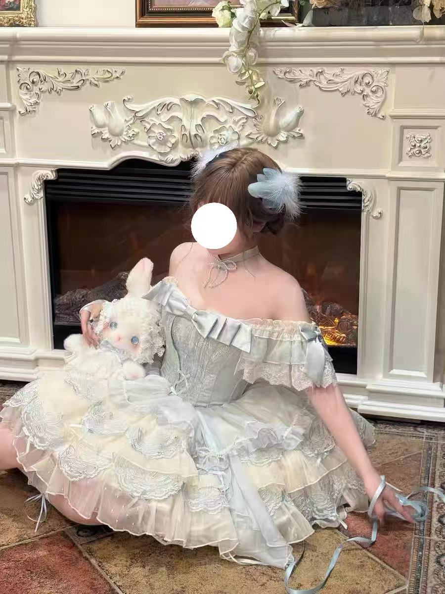 Design Concept:

This exquisite Sweet Lolita dress draws inspiration from classical ballet, featuring a delicate blue color scheme and intricate embroidery that creates an atmosphere of elegant sweetness. The dress comes with a beautifully crafted bow accent on the chest and includes a detachable train, adding a touch of princess-like grandeur to your ensemble. Made from high-quality tulle and cotton fabrics, the full skirt creates a lovely silhouette reminiscent of a ballerina's tutu, while the detailed em