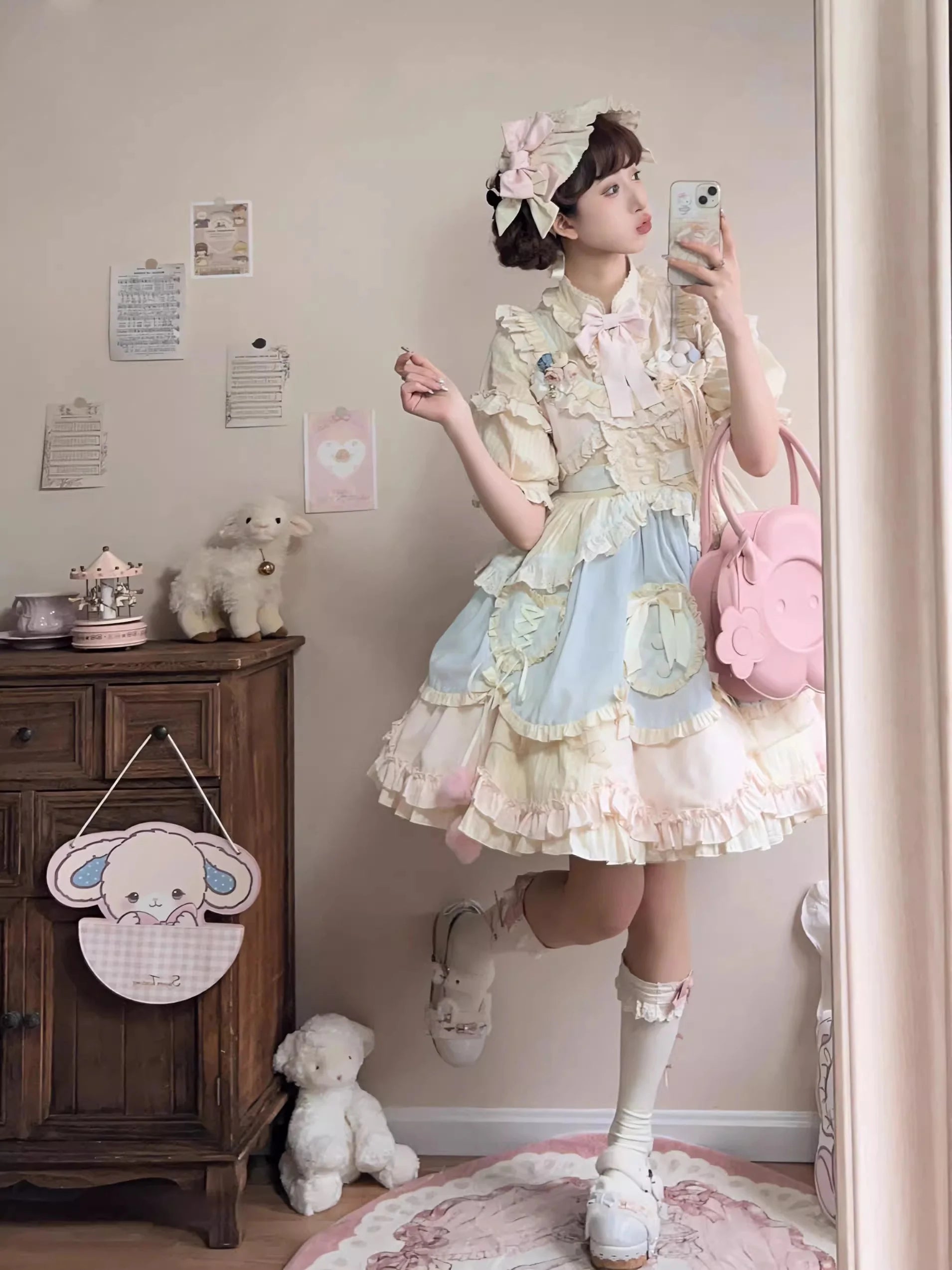 Design Concept:

This Sweet Lolita blue and pink sleeveless JSK dress features layered ruffles, delicate lace, and charming bow details, creating a sweet and playful style. The short version design adds a light and youthful touch, perfect for showcasing a cute Lolita look. Product Details: The product includes one dress, offering a dreamy and elegant outfit for special occasions or daily Lolita fashion.