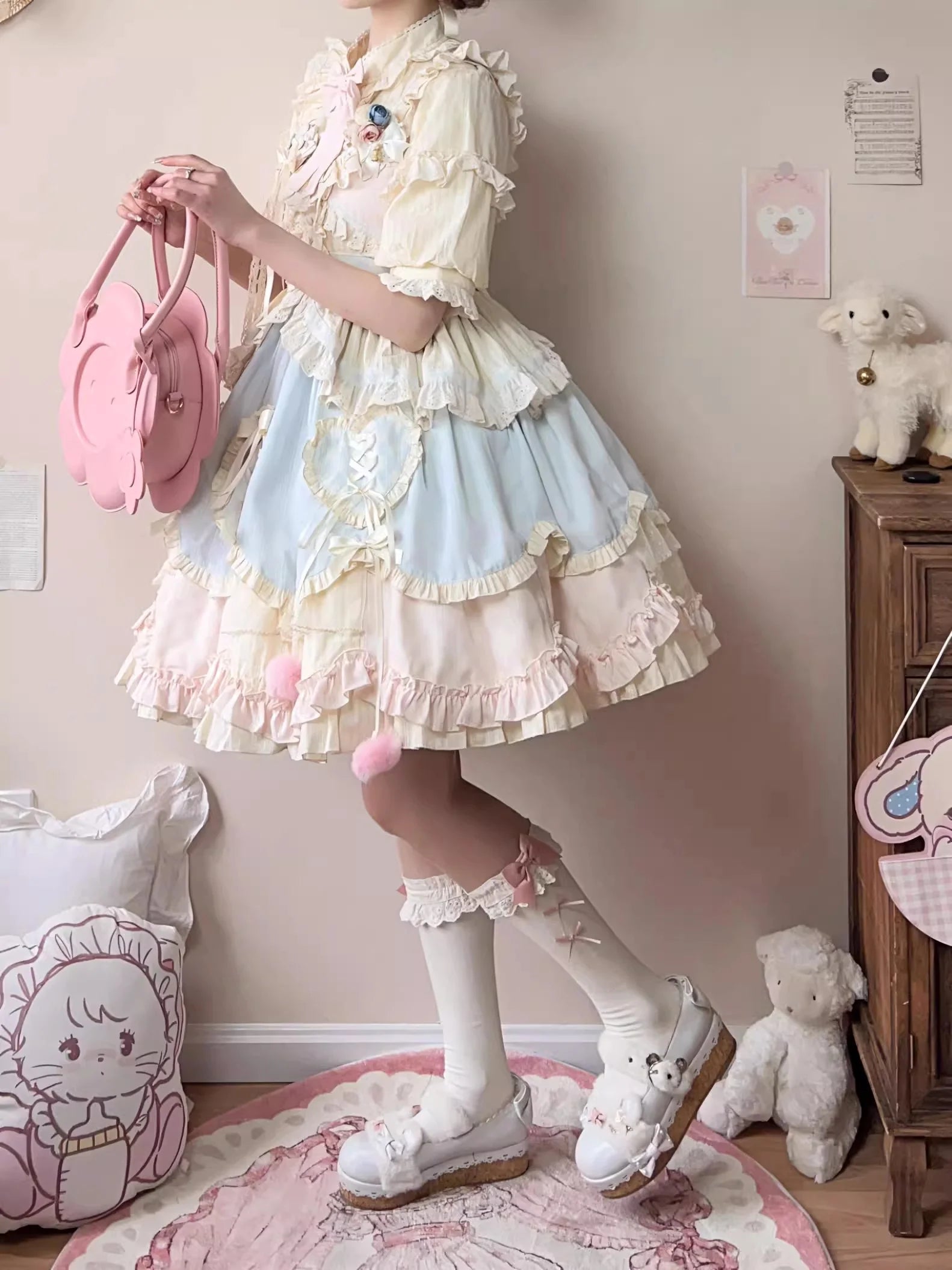 Design Concept:

This Sweet Lolita blue and pink sleeveless JSK dress features layered ruffles, delicate lace, and charming bow details, creating a sweet and playful style. The short version design adds a light and youthful touch, perfect for showcasing a cute Lolita look. Product Details: The product includes one dress, offering a dreamy and elegant outfit for special occasions or daily Lolita fashion.