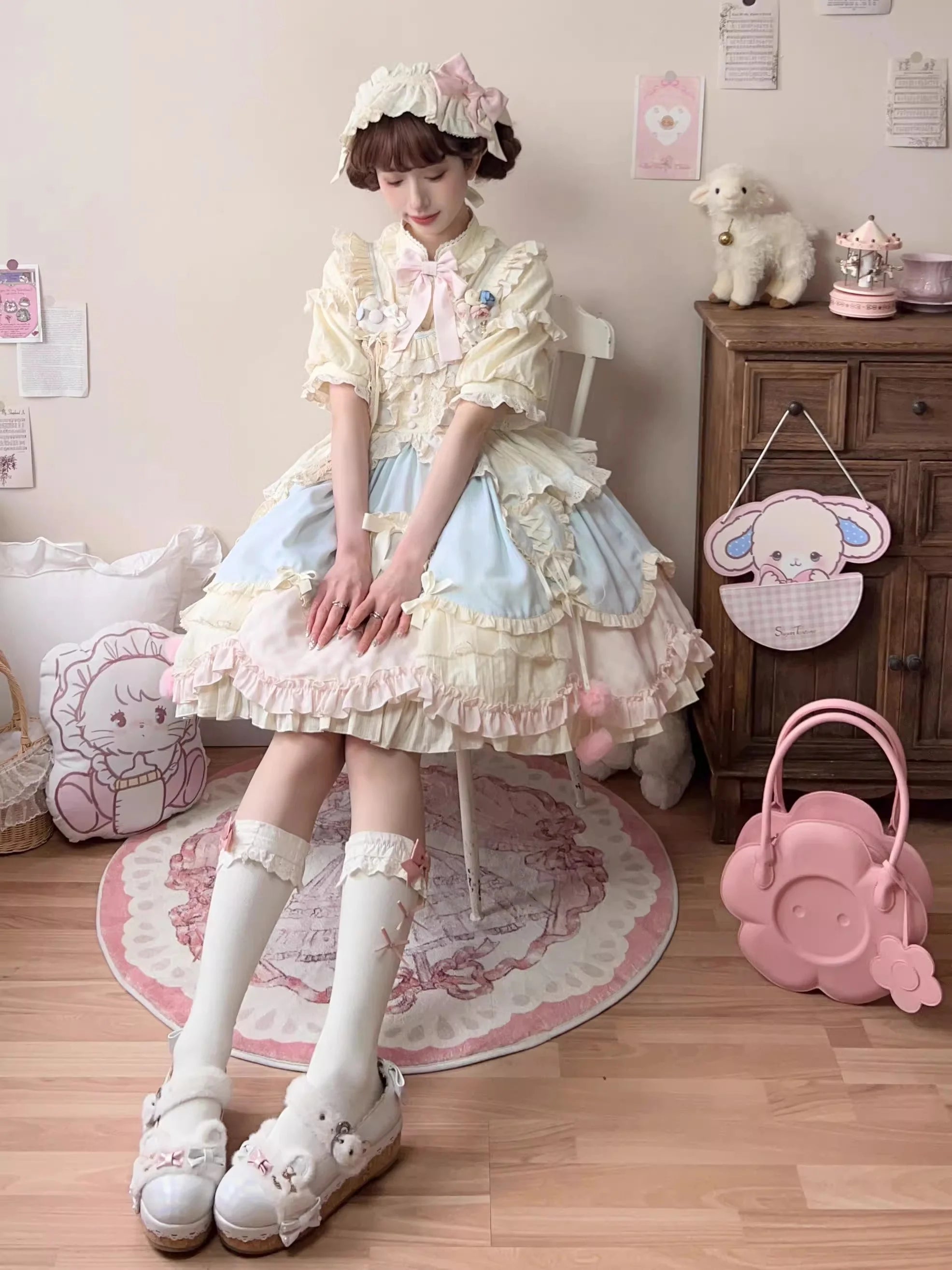 Design Concept:

This Sweet Lolita blue and pink sleeveless JSK dress features layered ruffles, delicate lace, and charming bow details, creating a sweet and playful style. The short version design adds a light and youthful touch, perfect for showcasing a cute Lolita look. Product Details: The product includes one dress, offering a dreamy and elegant outfit for special occasions or daily Lolita fashion.