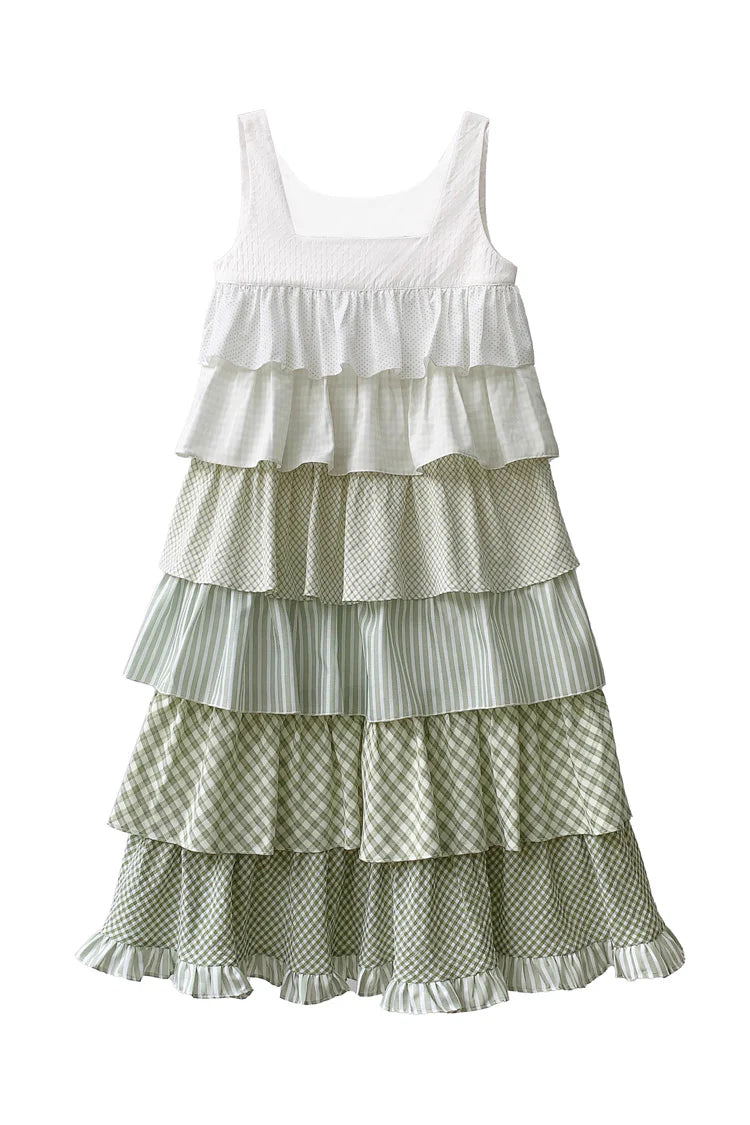 Design Concept:

This Sweet Lolita green layered printed ruffle JSK dress captures a playful holiday charm with its soft tones and delicate details. The multi-layered ruffles add volume and elegance, while the printed design enhances its sweet and lively style. The product includes one dress with a matching belt, creating a coordinated and flattering Lolita look.