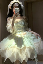 Design Concept:&nbsp;

This Sweet Lolita green sleeveless jacquard JSK dress features ruffles, bowknot lace, and an irregular hem, blending sweet elegance with Chinese ballet-inspired charm. The soft green tone adds a refreshing and graceful feel, perfect for a unique Lolita style. The product includes the main dress, a detachable rose for the waist, a detachable rose for the chest, a pair of detachable wrist sleeves, and a matching floral hair accessory, forming a complete five-piece set.