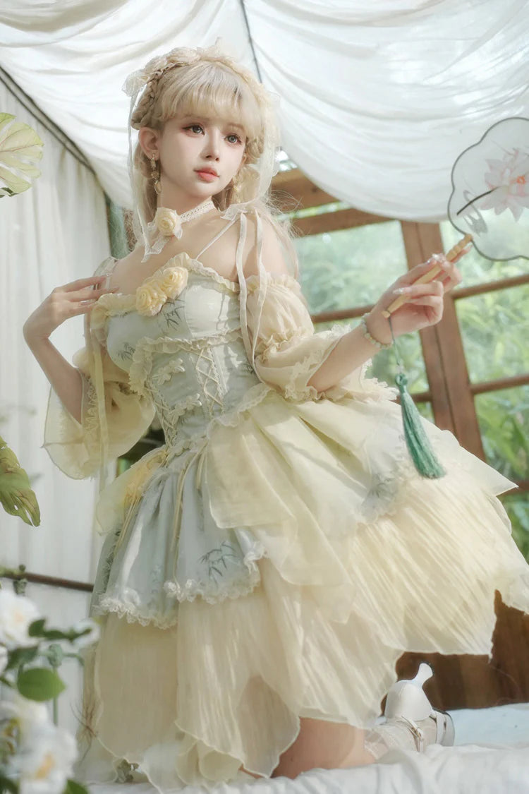 Design Concept:&nbsp;

This Sweet Lolita green sleeveless jacquard JSK dress features ruffles, bowknot lace, and an irregular hem, blending sweet elegance with Chinese ballet-inspired charm. The soft green tone adds a refreshing and graceful feel, perfect for a unique Lolita style. The product includes the main dress, a detachable rose for the waist, a detachable rose for the chest, a pair of detachable wrist sleeves, and a matching floral hair accessory, forming a complete five-piece set.