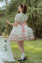 Design Concept:
Delight in playful elegance with this Sweet Lolita dress in soft white and pink tones. Featuring short sleeves, multi-layered ruffles, and charming bow accents, it exudes a sweet and refined aesthetic. The flowing silhouette enhances a graceful look, making it perfect for tea parties, casual outings, or themed gatherings. Comfortable and visually enchanting, this dress brings a youthful, princess-like charm to any Lolita wardrobe.